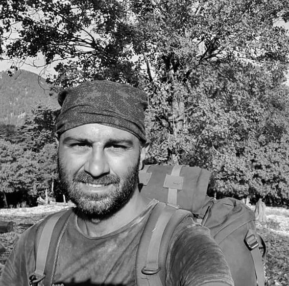 Hasan Yılmaz outdoors with a hiking backpack